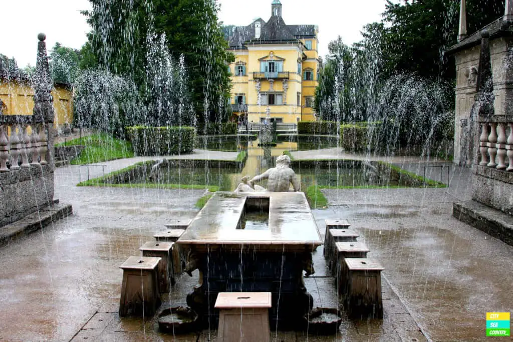 Only one chair stays dry at the Trick Fountains in Castle Hellbrunn. A fun place especially during hot summer days.