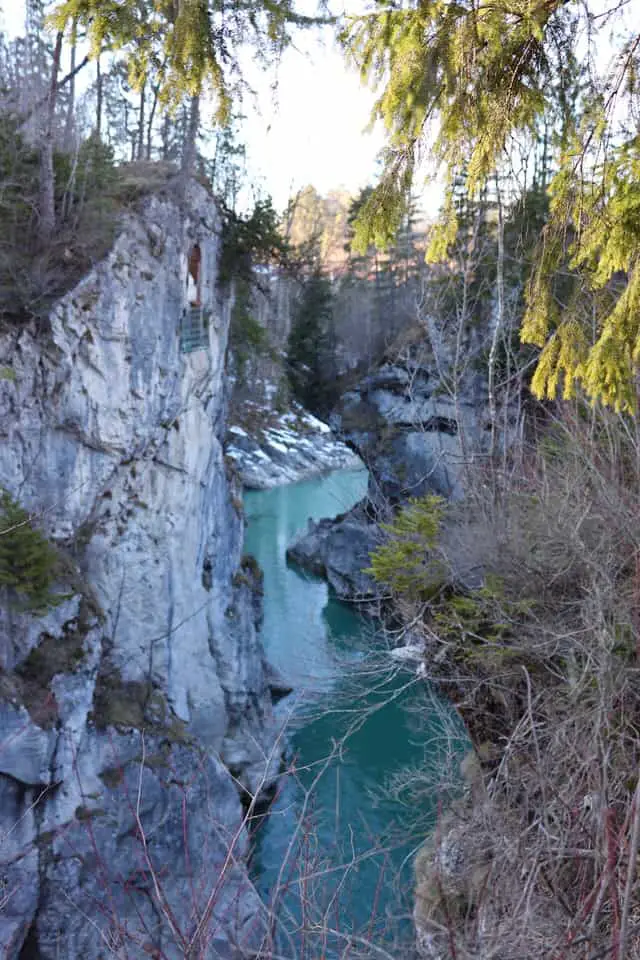 Lechfall gorge with steep cliffs and emerald green river Lech flowing 