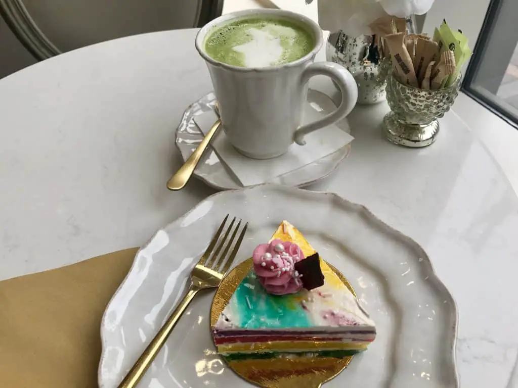 rainbow cake and matcha chai latte at vegan bakery Sorelle & Co in Toronto