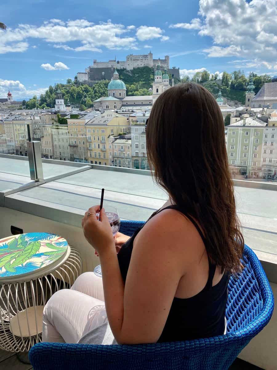 view from a rooftop bar in Salzburg with the Old Town and the Fortress Hohensalzburg
