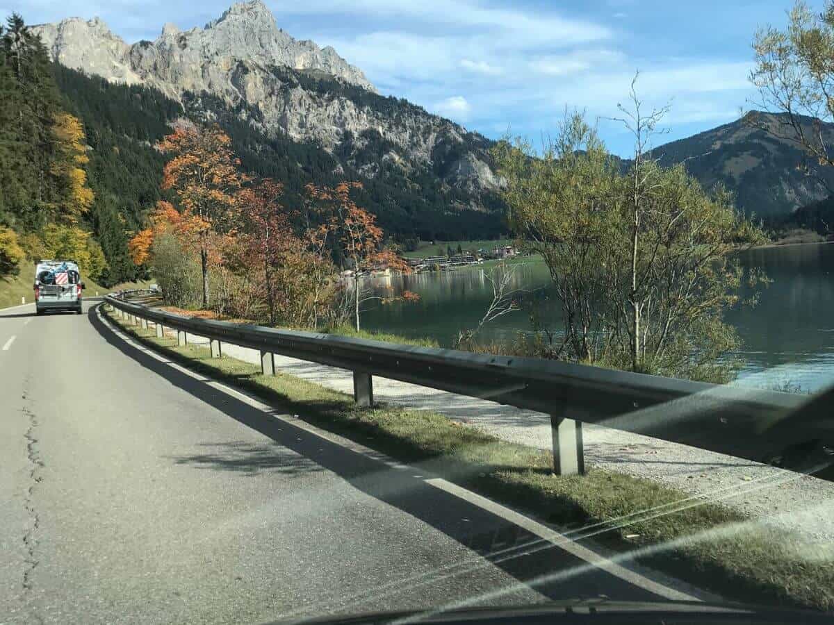 scenic road in Tyrol along the Lake Haldensee with the impressive mountains in the background