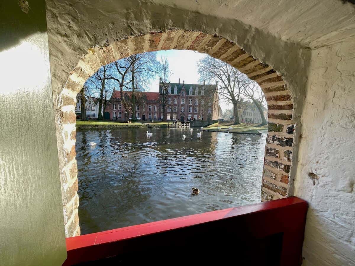 View from the inner courtyard of the Beguinage with the lake and the famous swans.