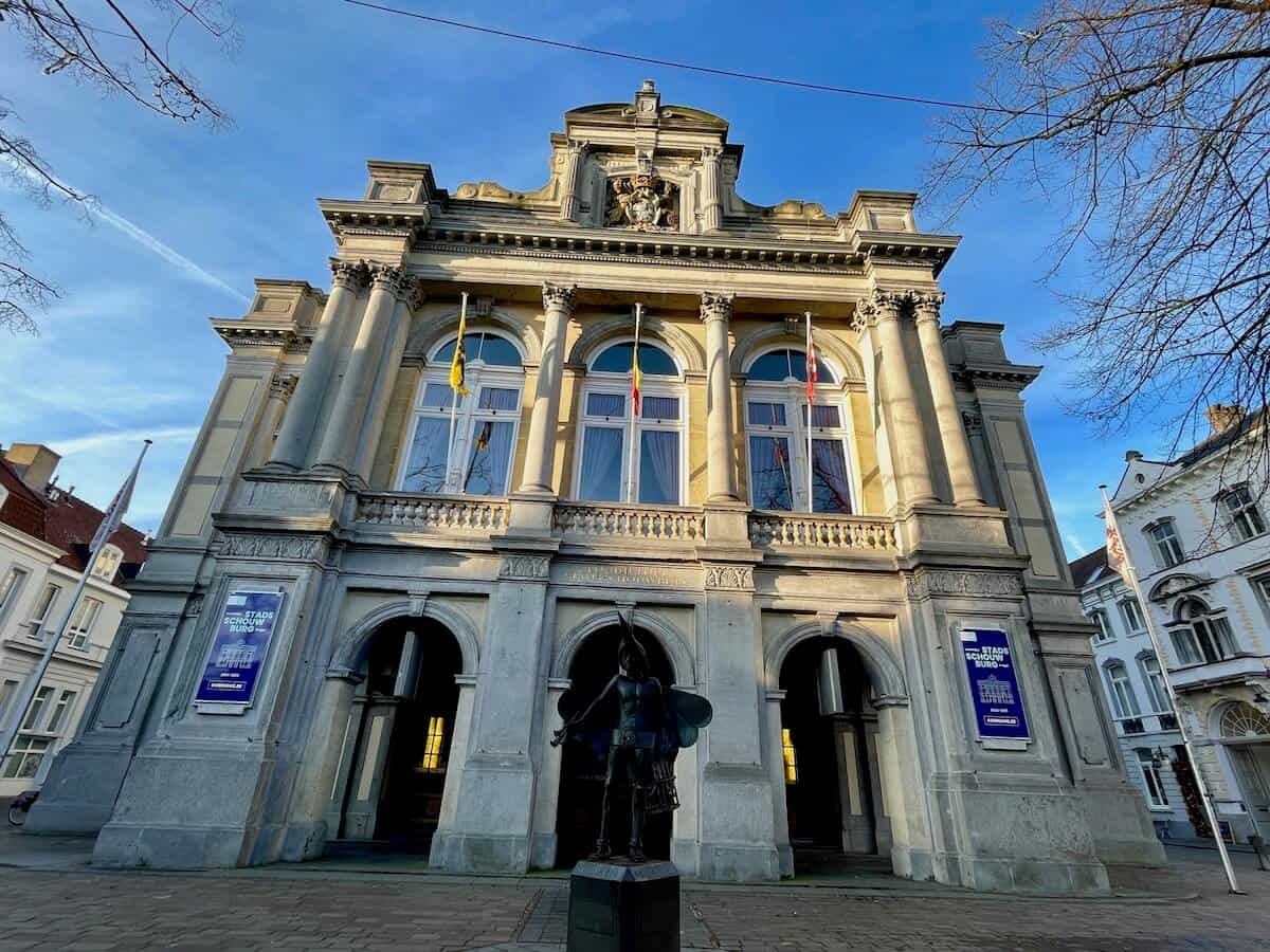 view of the city theater in Bruges with three high entrance areas and three huge windows