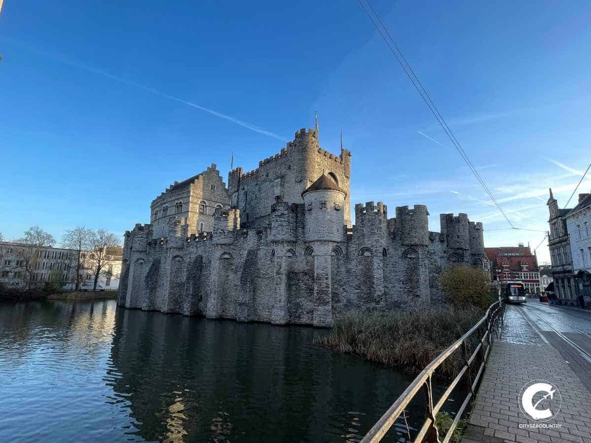 Castle Gravensteen in Ghent, surrounded by the river Leie.