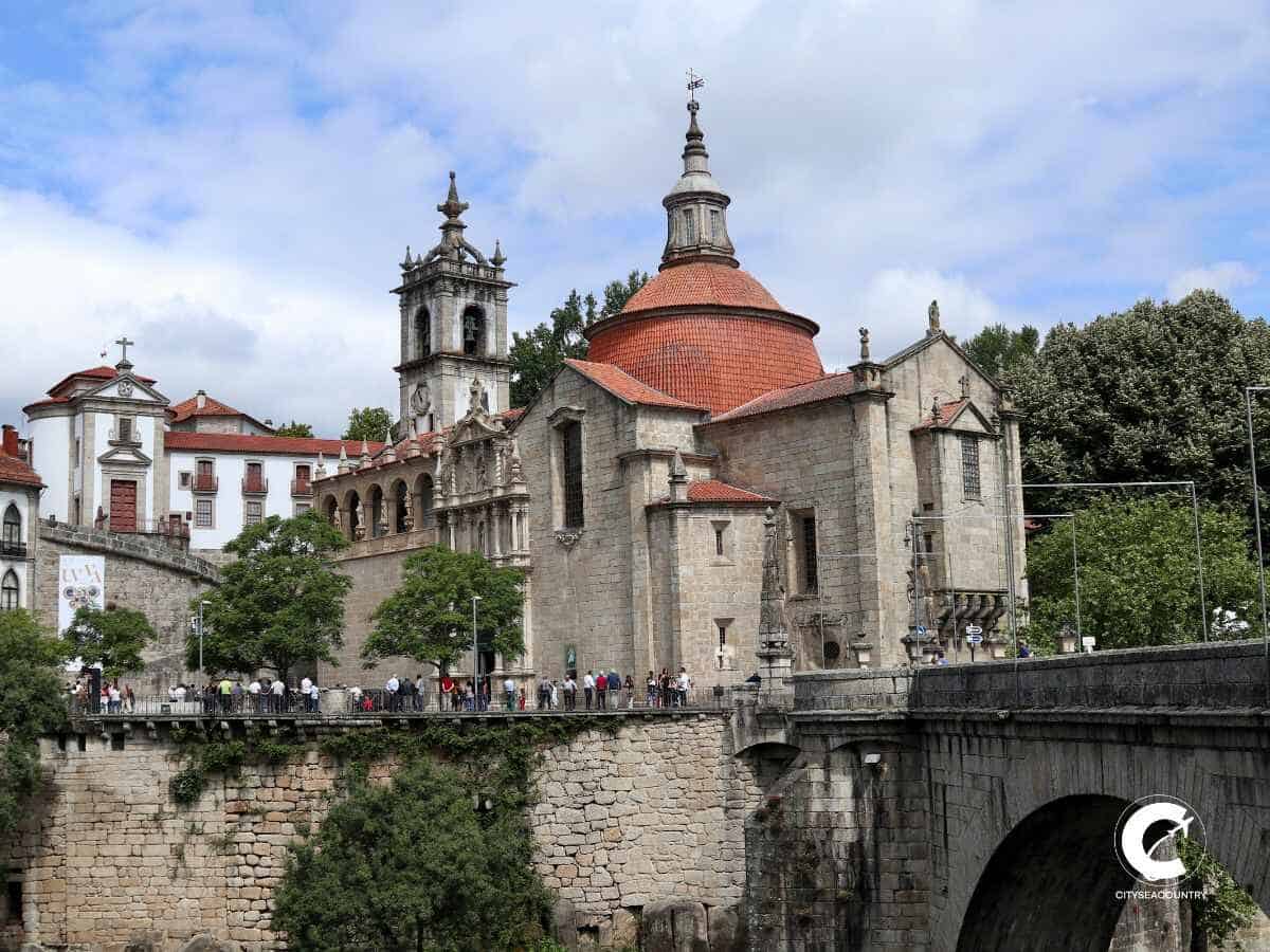 View of the church in Amarante and a stone bridge across a canyon.